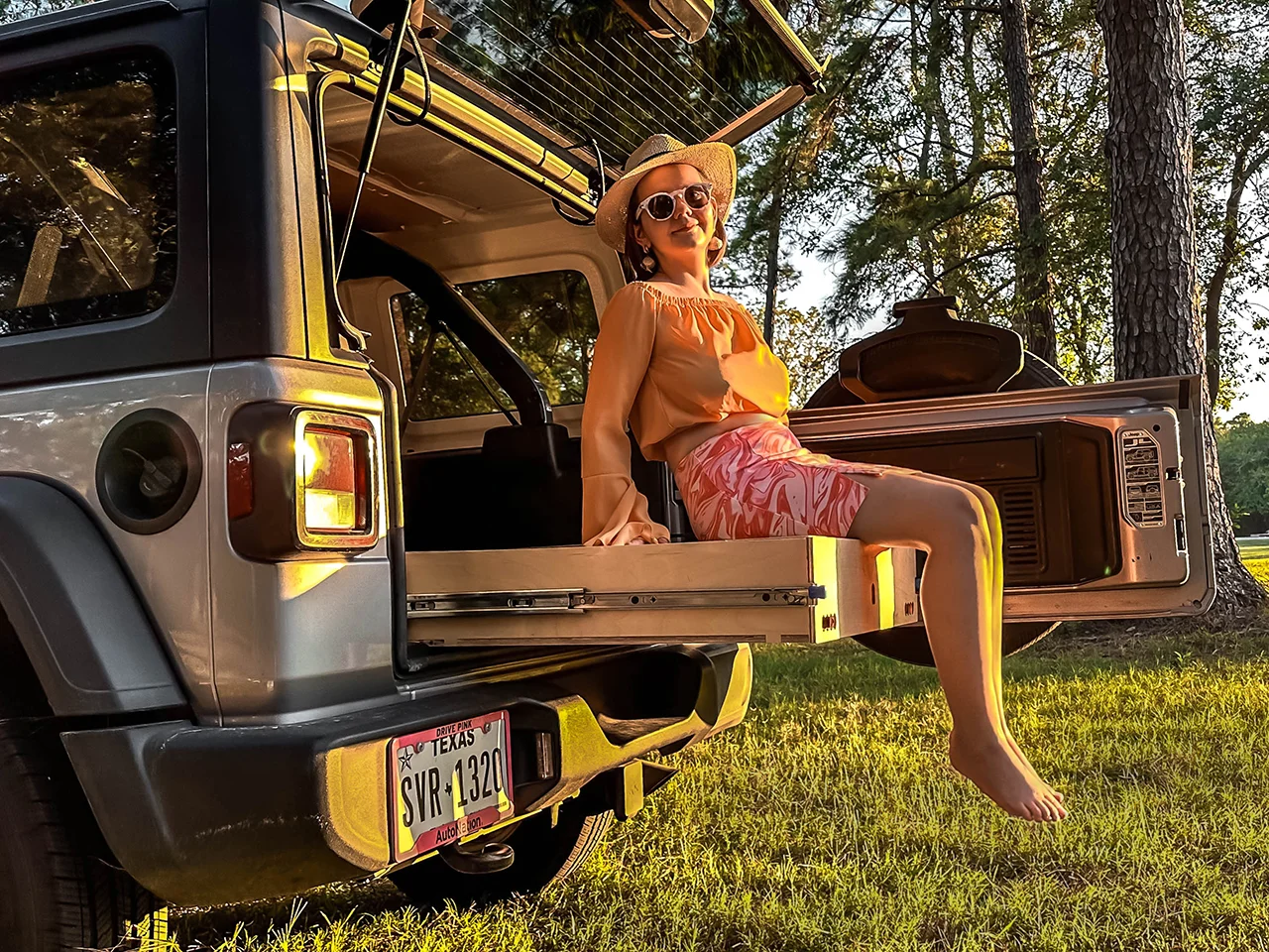 Girl sitting on cargo drawer yellowstone